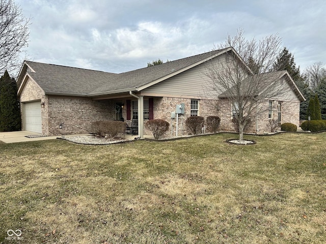 view of front facade with a front lawn, an attached garage, brick siding, and a shingled roof