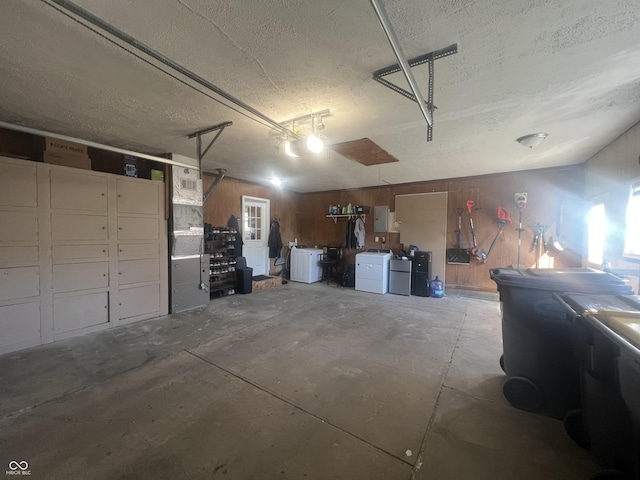 garage featuring wood walls