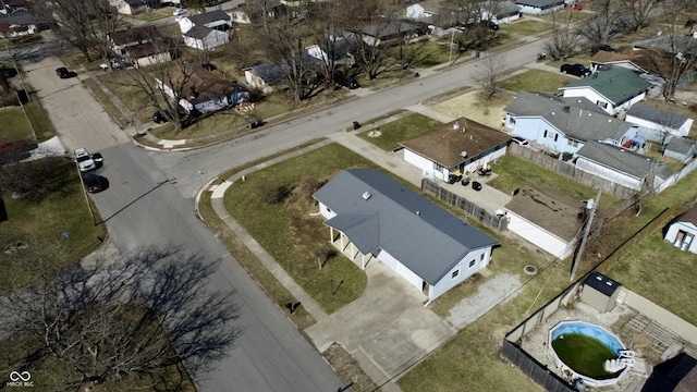 birds eye view of property with a residential view