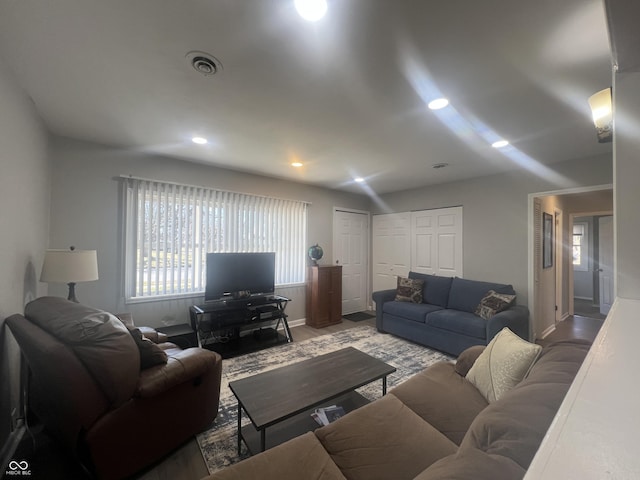 living area featuring visible vents, recessed lighting, and baseboards