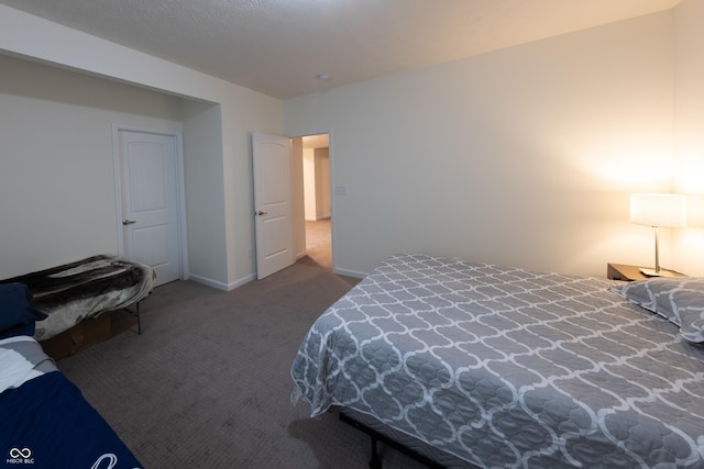 carpeted bedroom with baseboards