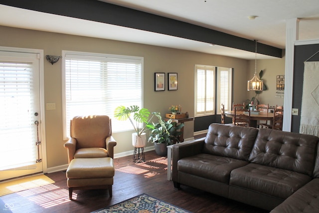 living room featuring dark wood finished floors and baseboards