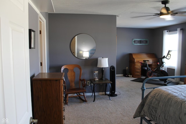 bedroom with baseboards and light colored carpet