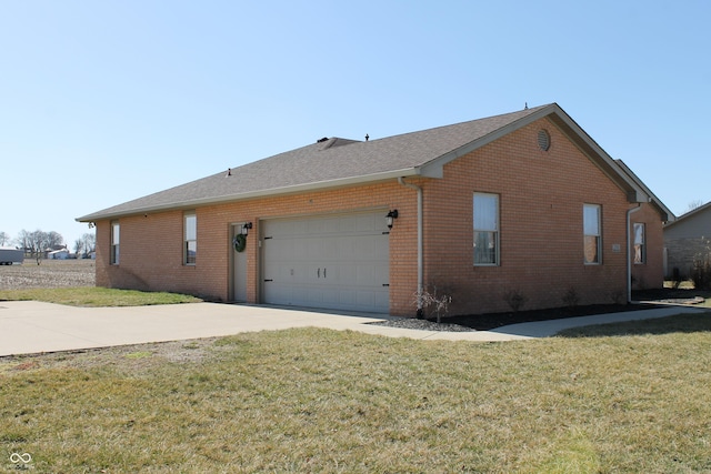 view of home's exterior featuring concrete driveway, brick siding, a lawn, and an attached garage