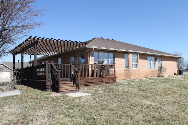 rear view of house with cooling unit, brick siding, a yard, a wooden deck, and a pergola