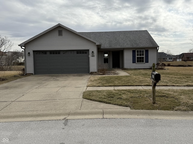 ranch-style house with an attached garage, a shingled roof, concrete driveway, and a front yard