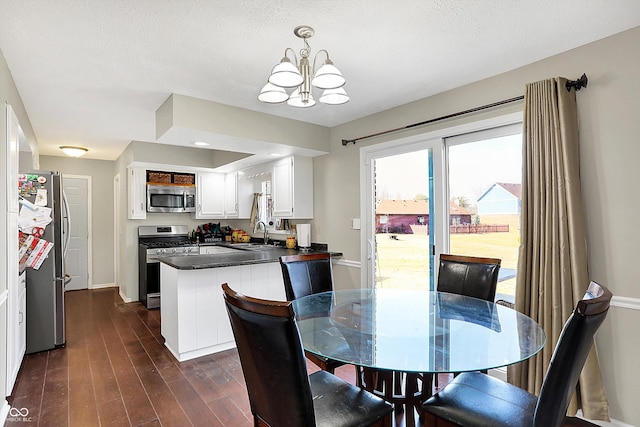 dining area with baseboards, a notable chandelier, and dark wood-style flooring