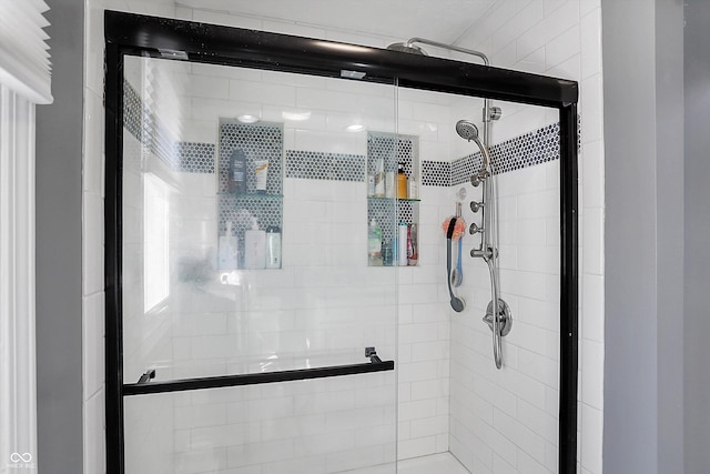 full bathroom featuring a shower stall