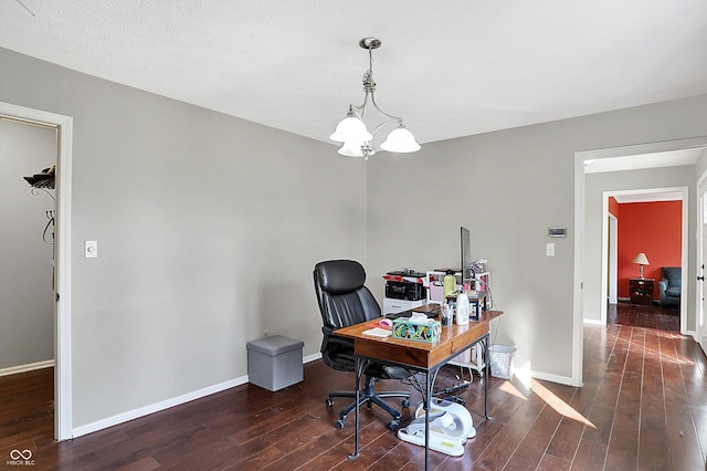 home office with a chandelier, baseboards, and hardwood / wood-style flooring