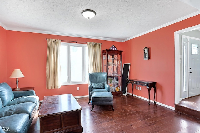 living room featuring ornamental molding, baseboards, and wood finished floors