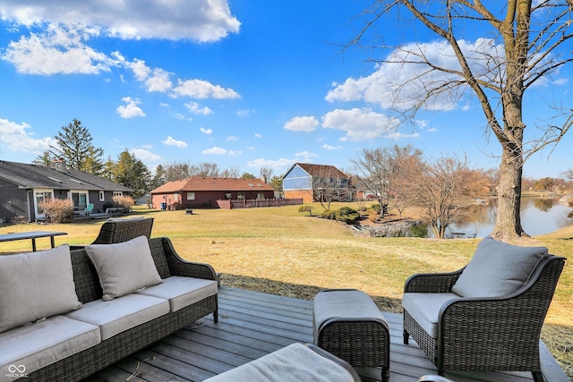 deck featuring an outdoor hangout area and a lawn