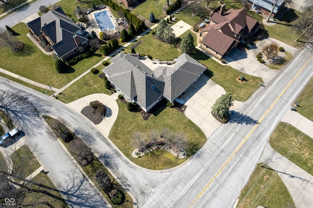 birds eye view of property with a residential view