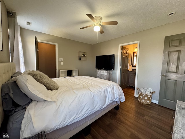 bedroom with visible vents, a textured ceiling, baseboards, ceiling fan, and dark wood-style flooring