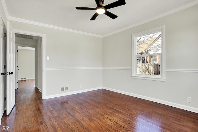 unfurnished room featuring visible vents, dark wood finished floors, and crown molding