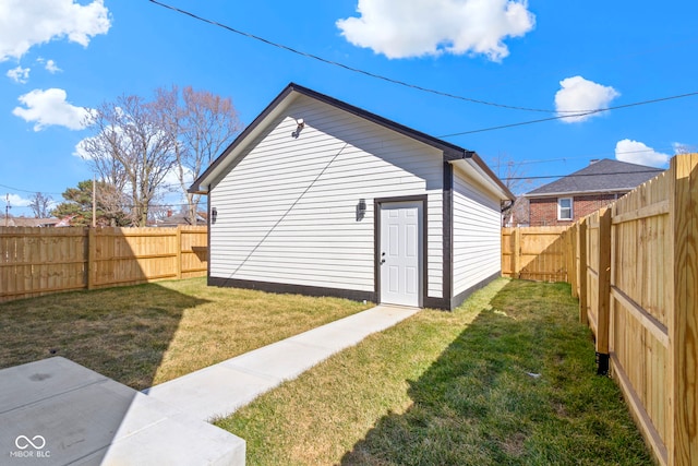 view of outbuilding featuring a fenced backyard