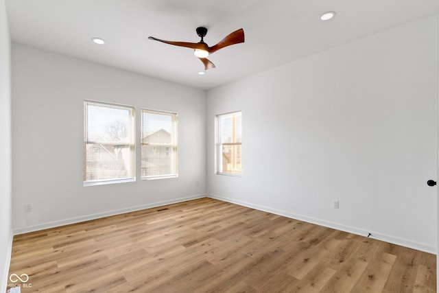 unfurnished room featuring recessed lighting, light wood-style flooring, baseboards, and ceiling fan