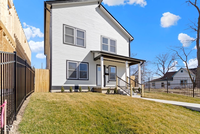 view of front of property featuring a porch, a fenced backyard, and a front lawn