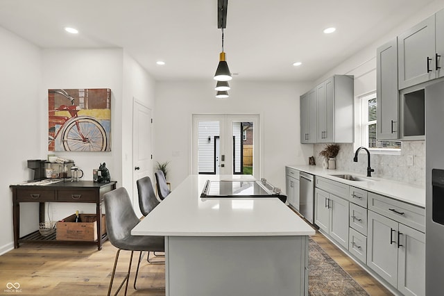 35 N Keystone Ave, Indianapolis, IN 46201 - kitchen featuring a sink, french doors, gray cabinets, stovetop, and stainless steel dishwasher