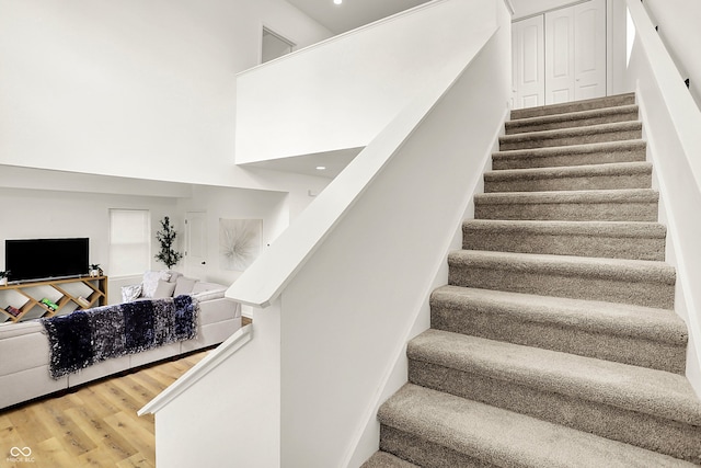 35 N Keystone Ave, Indianapolis, IN 46201 - staircase featuring a towering ceiling and wood finished floors