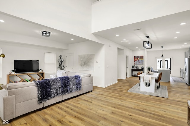 35 N Keystone Ave, Indianapolis, IN 46201 - living area with light wood-style floors, visible vents, baseboards, and recessed lighting