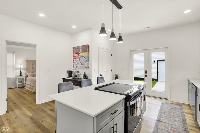 35 N Keystone Ave, Indianapolis, IN 46201 - kitchen featuring light countertops, light wood finished floors, black range with electric stovetop, and gray cabinets