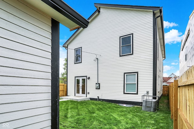 35 N Keystone Ave, Indianapolis, IN 46201 - back of house with a yard, cooling unit, french doors, and a fenced backyard