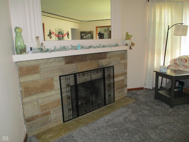 living room with a fireplace, baseboards, and carpet floors