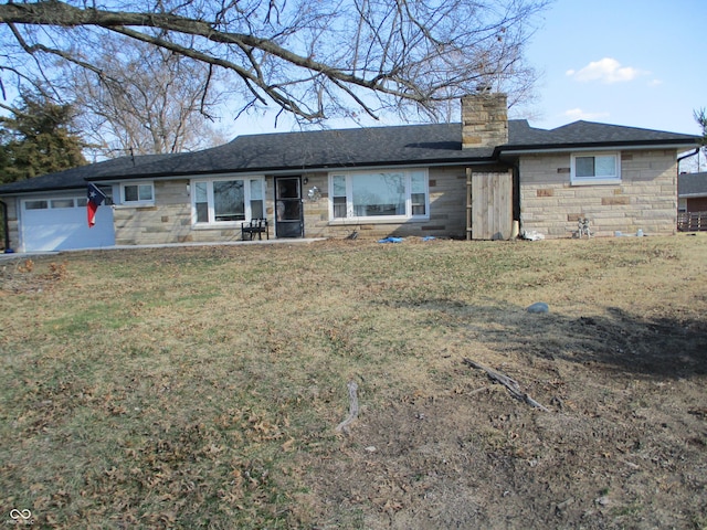 view of front of house with a front lawn, an attached garage, stone siding, and a chimney