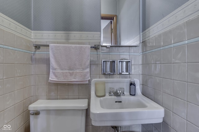 1459 S Josephine St, Martinsville, IN 46151 - half bathroom with tile walls, wallpapered walls, toilet, and a sink