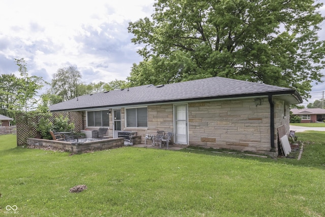 1459 S Josephine St, Martinsville, IN 46151 - rear view of house featuring stone siding, a patio area, a shingled roof, and a lawn