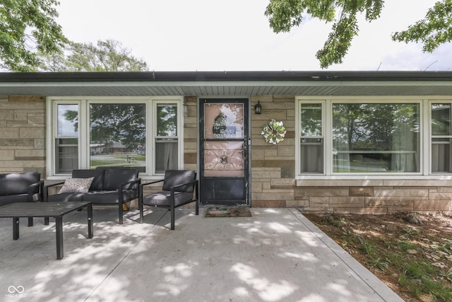 1459 S Josephine St, Martinsville, IN 46151 - doorway to property featuring stone siding, an outdoor hangout area, and a patio area