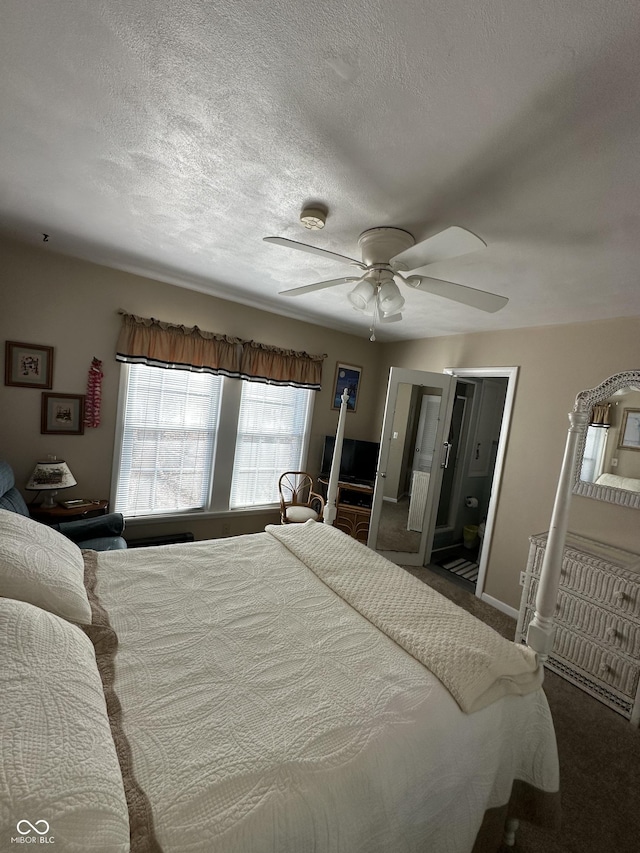 carpeted bedroom featuring connected bathroom, baseboards, a textured ceiling, and ceiling fan