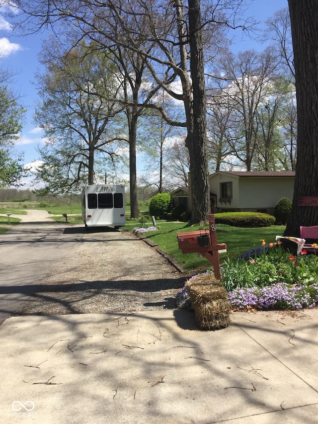 view of front of property with driveway and a front yard