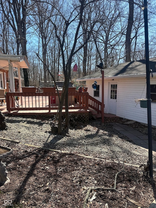 view of yard with a wooden deck