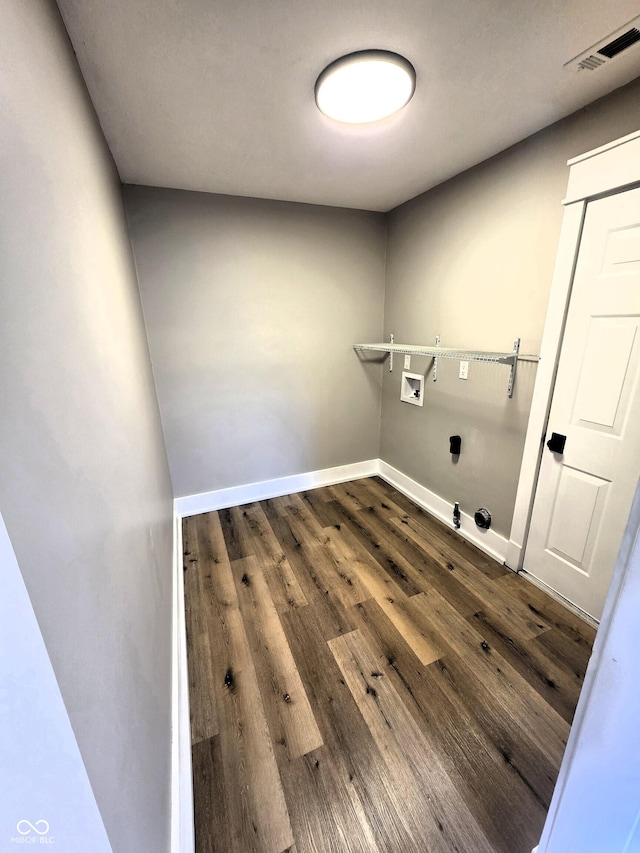 washroom with hookup for a washing machine, visible vents, dark wood finished floors, laundry area, and electric dryer hookup