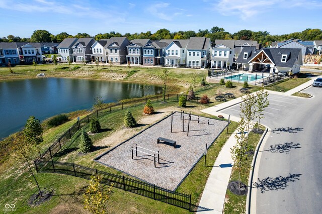 aerial view featuring a water view and a residential view