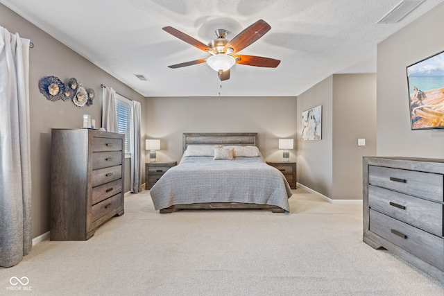 bedroom featuring visible vents, baseboards, a ceiling fan, and carpet flooring