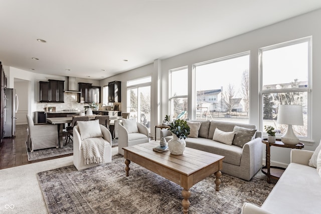 living room featuring recessed lighting and dark wood-style flooring