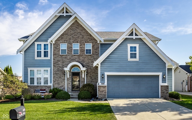 craftsman inspired home with brick siding, concrete driveway, and a front lawn