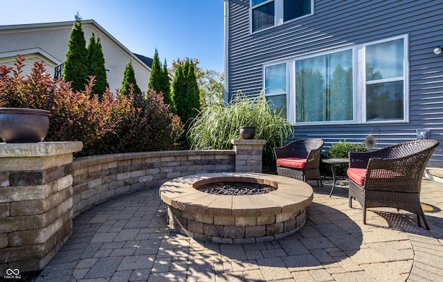 view of patio / terrace with an outdoor fire pit