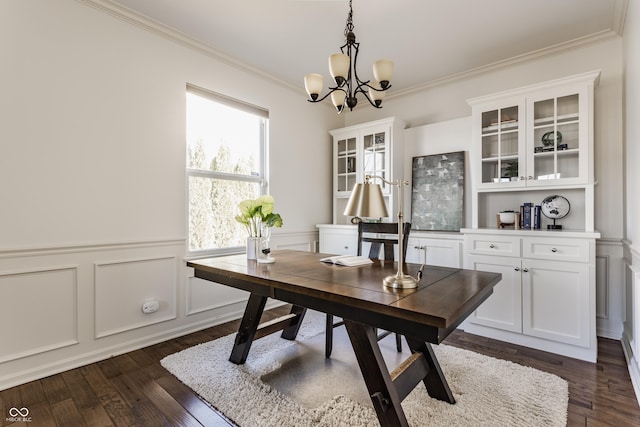 office space with dark wood-type flooring, a decorative wall, wainscoting, and ornamental molding