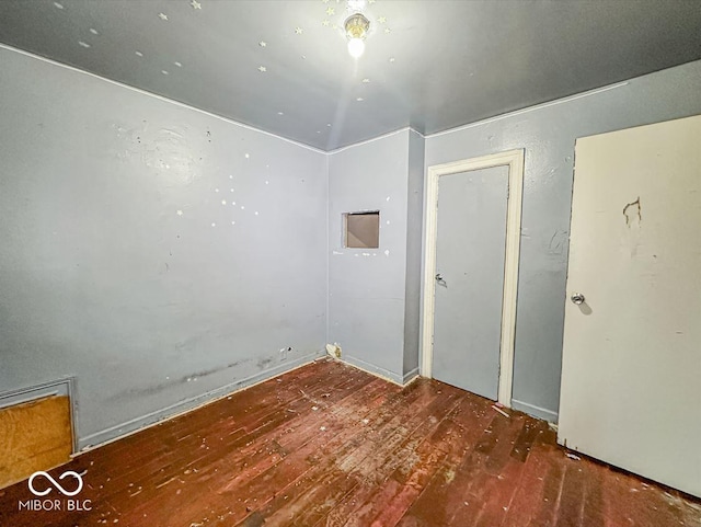 unfurnished room featuring hardwood / wood-style flooring