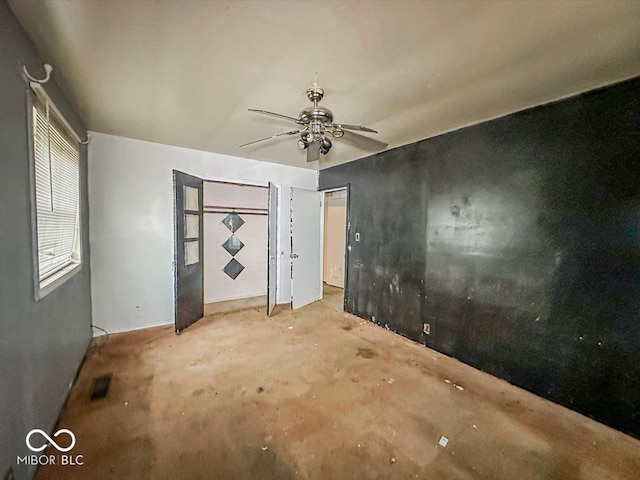 unfurnished bedroom with visible vents and a ceiling fan