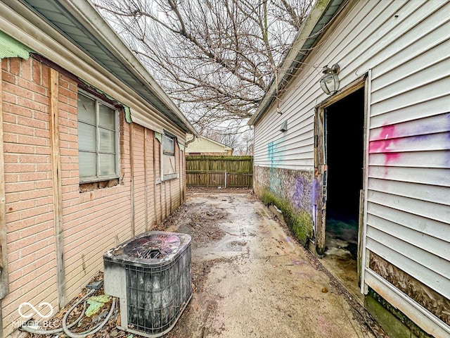 exterior space with fence and central air condition unit