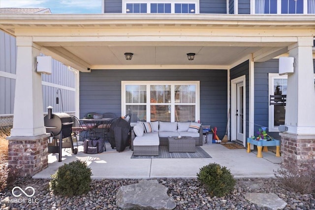 view of patio with area for grilling and an outdoor hangout area