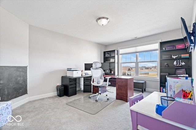 office space featuring baseboards and carpet flooring