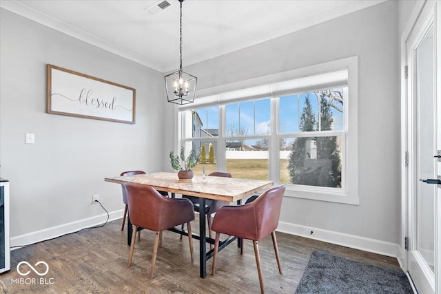 dining space with visible vents, baseboards, ornamental molding, and dark wood-style flooring