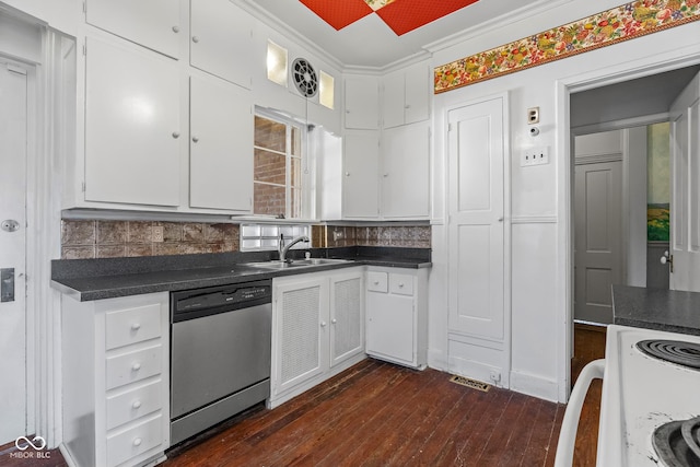 kitchen with stainless steel dishwasher, dark countertops, white cabinets, and a sink