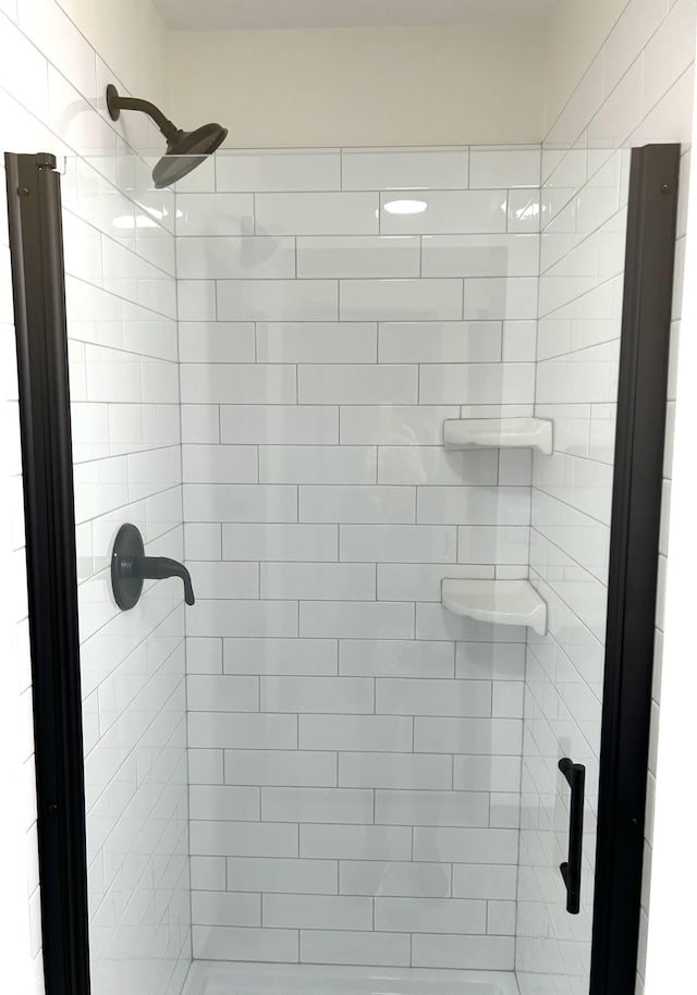 full bathroom with a shower stall