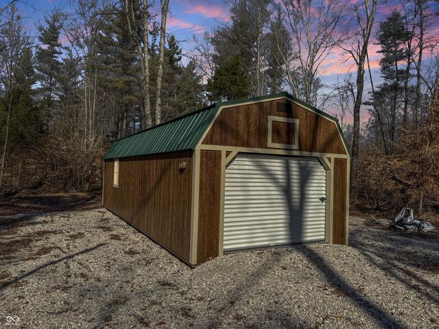 view of outbuilding with an outbuilding and gravel driveway